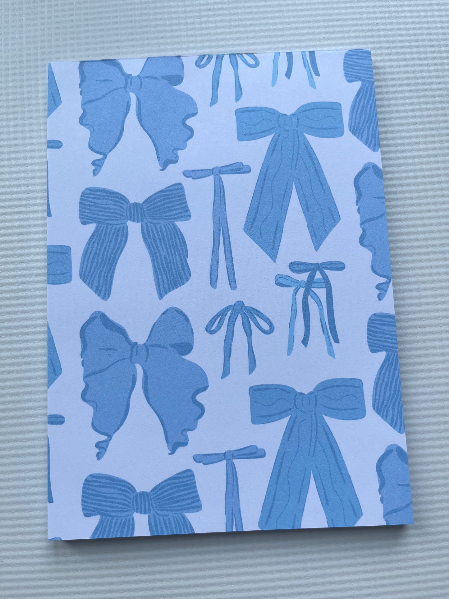 Blue bow notepad