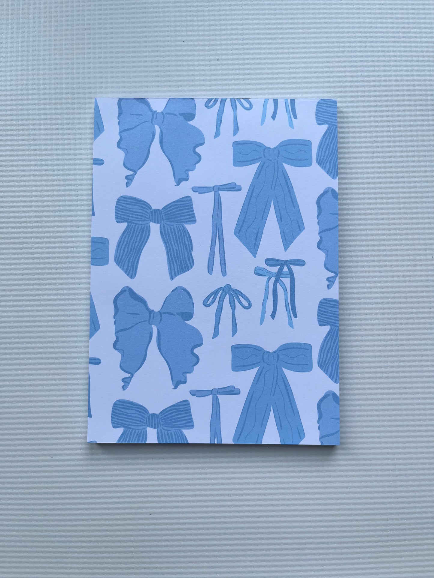 Blue bow notepad